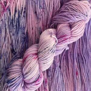 Light pink and purple yarn with bright pink and dark purple speckles