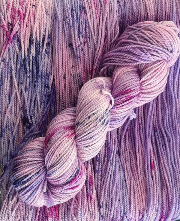 Light pink and purple yarn with bright pink and dark purple speckles